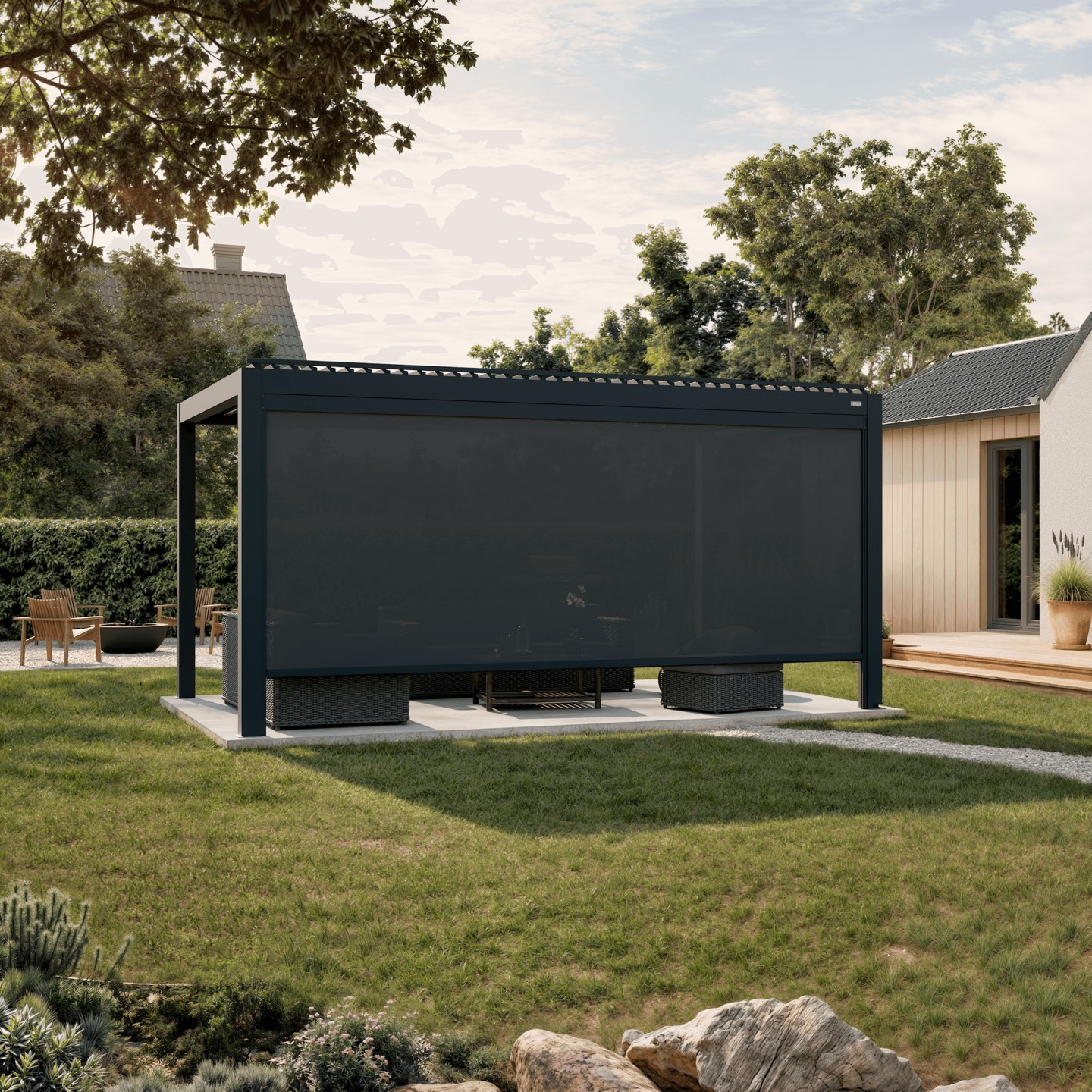 Anthracite Ombra pergola with a guided zip screen lowered, forming a sheltered outdoor room